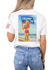 White t-shirt with a graphic of a woman holding a flag and 'TRUMP 28' text on the back, worn by a person.