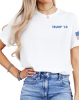 Person wearing a white t-shirt with 'TRUMP '28' text and an American flag on a white background