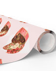 Retro wrapping paper roll that features heart-shaped candy boxes against a pink background.