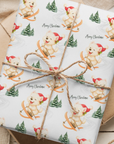 Christmas wrapping paper featuring a sweet westie dog in a santa hat skiing down alpine slopes, on a snowy background.