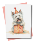 Greeting card with a westie dog wearing a party hat and holding a gift box on a white background.