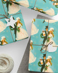 Presents wrapped in a 1960s inspirited wrapping paper featuring a retro bride and groom in winter wedding wear on a turquoise background.