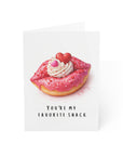 Romantic Valentine’s Day greeting card with pink frosted donut lips, heart sprinkles, whipped cream topping and the message “You're My Favorite Snack”