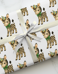childrens retro wrapping paper featuring a zebra wearing a party hat and bow on a white background