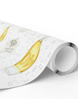 Roll of wrapping paper with champagne glass illustration.