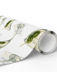 Gift wrapped in paper with martini glass design, two olives inscribed with a 4 and 0.