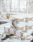 Gift wrap with bunny pattern with a blue gingham background