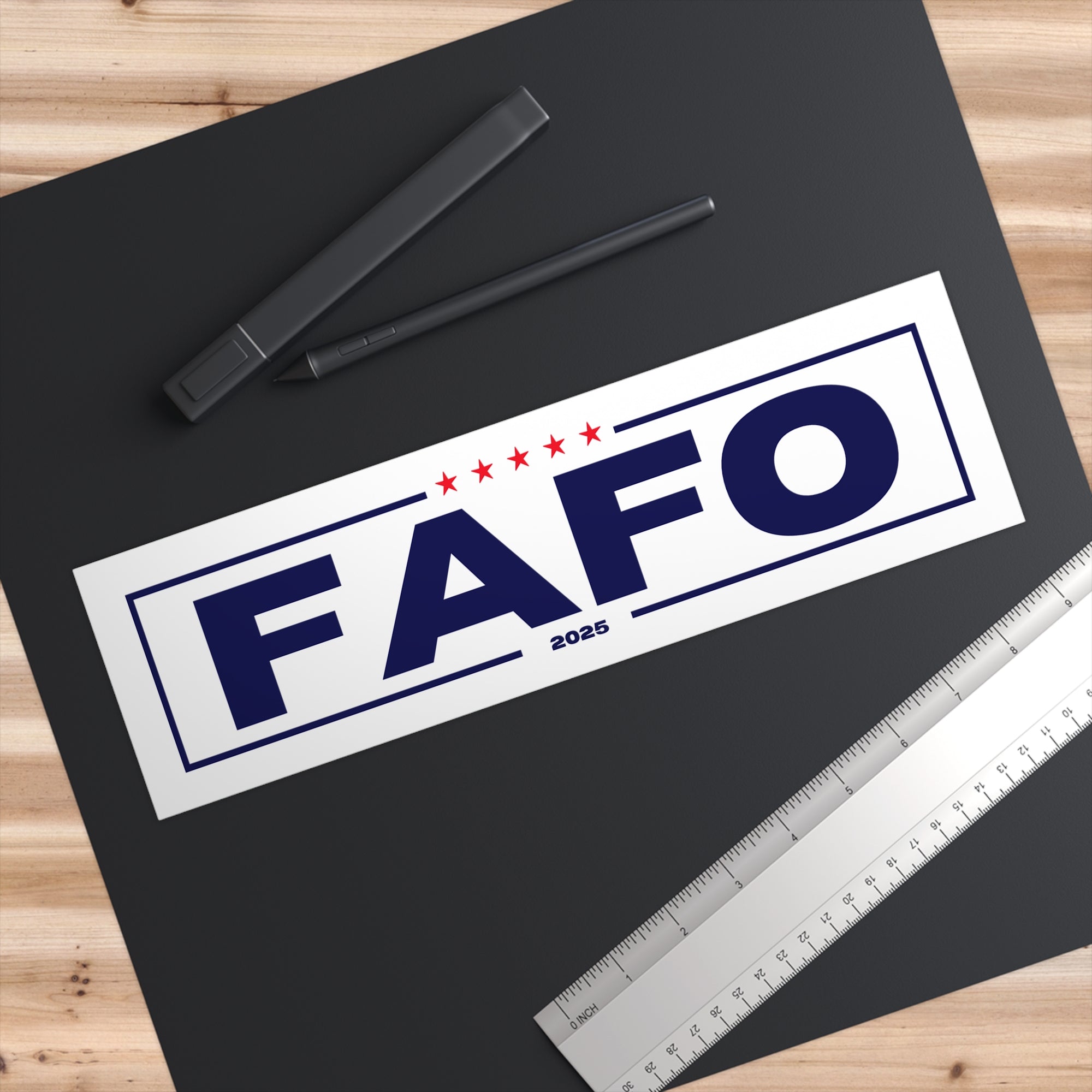 FAFO logo with stars on a black background with pens and a ruler.