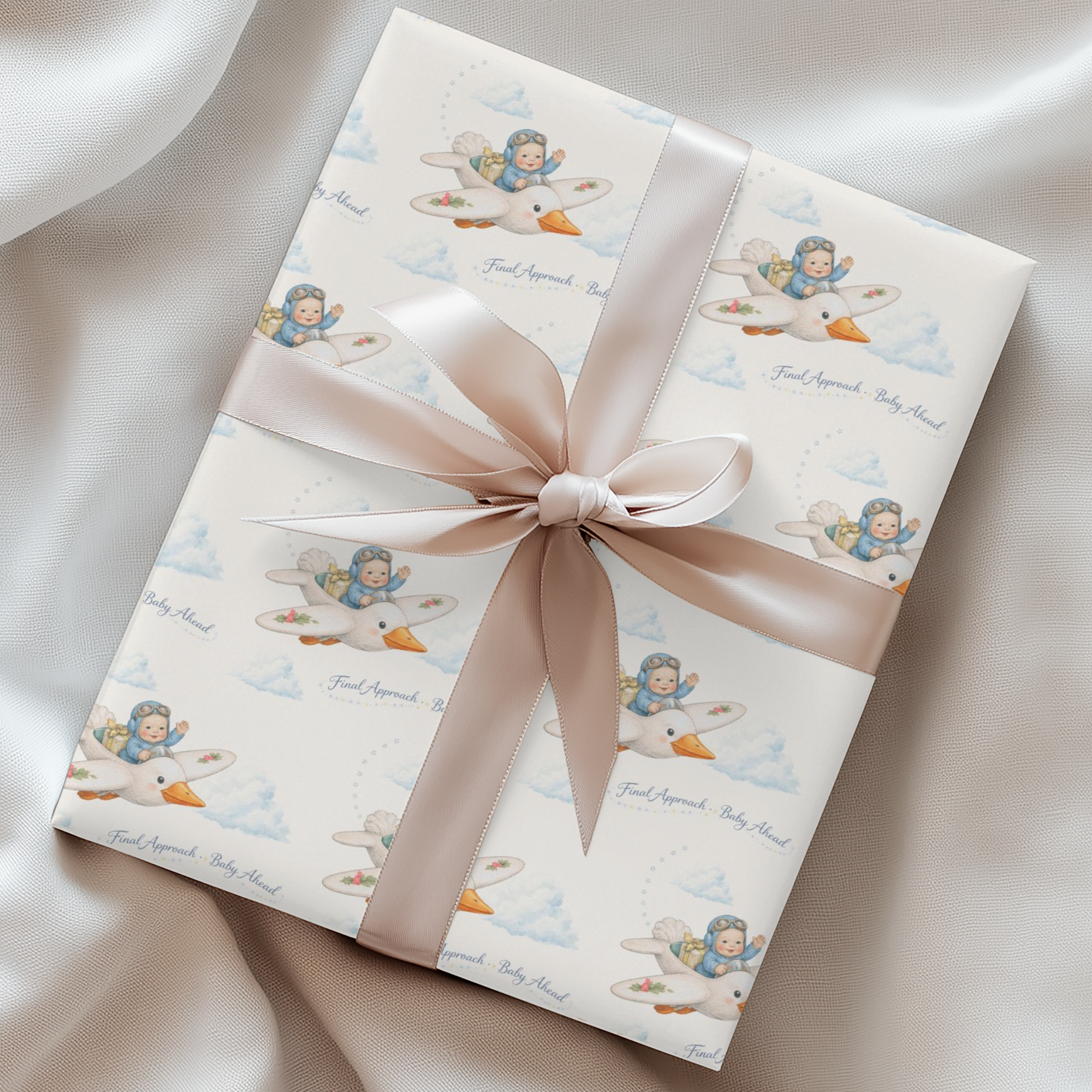 Gift box with a baby and stork design and pink ribbon on a soft background