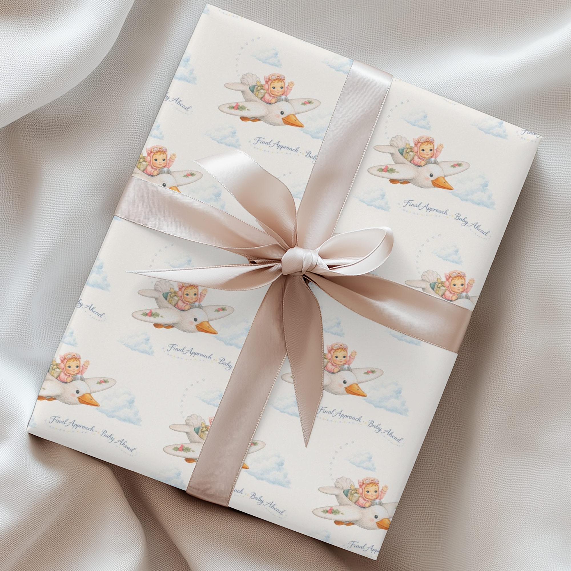 Baby girl wrapping paper with baby pilot in pink flying a stork shaped airplane in the clouds.