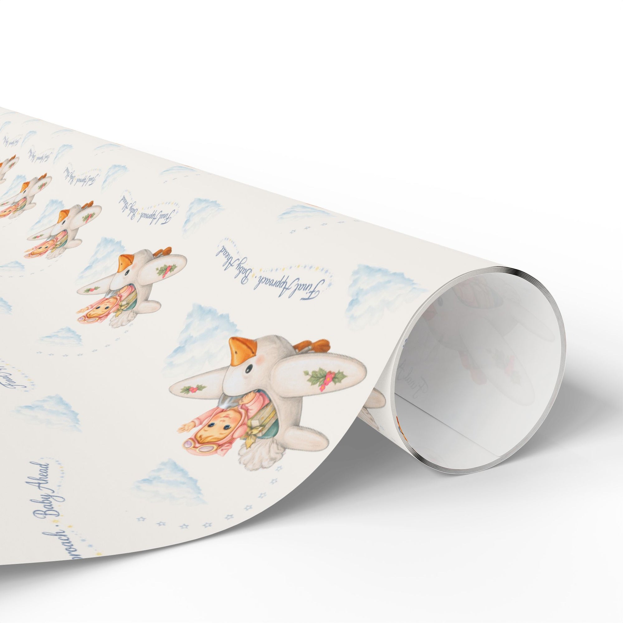 Roll of wrapping paper with a baby themed design on a light background.