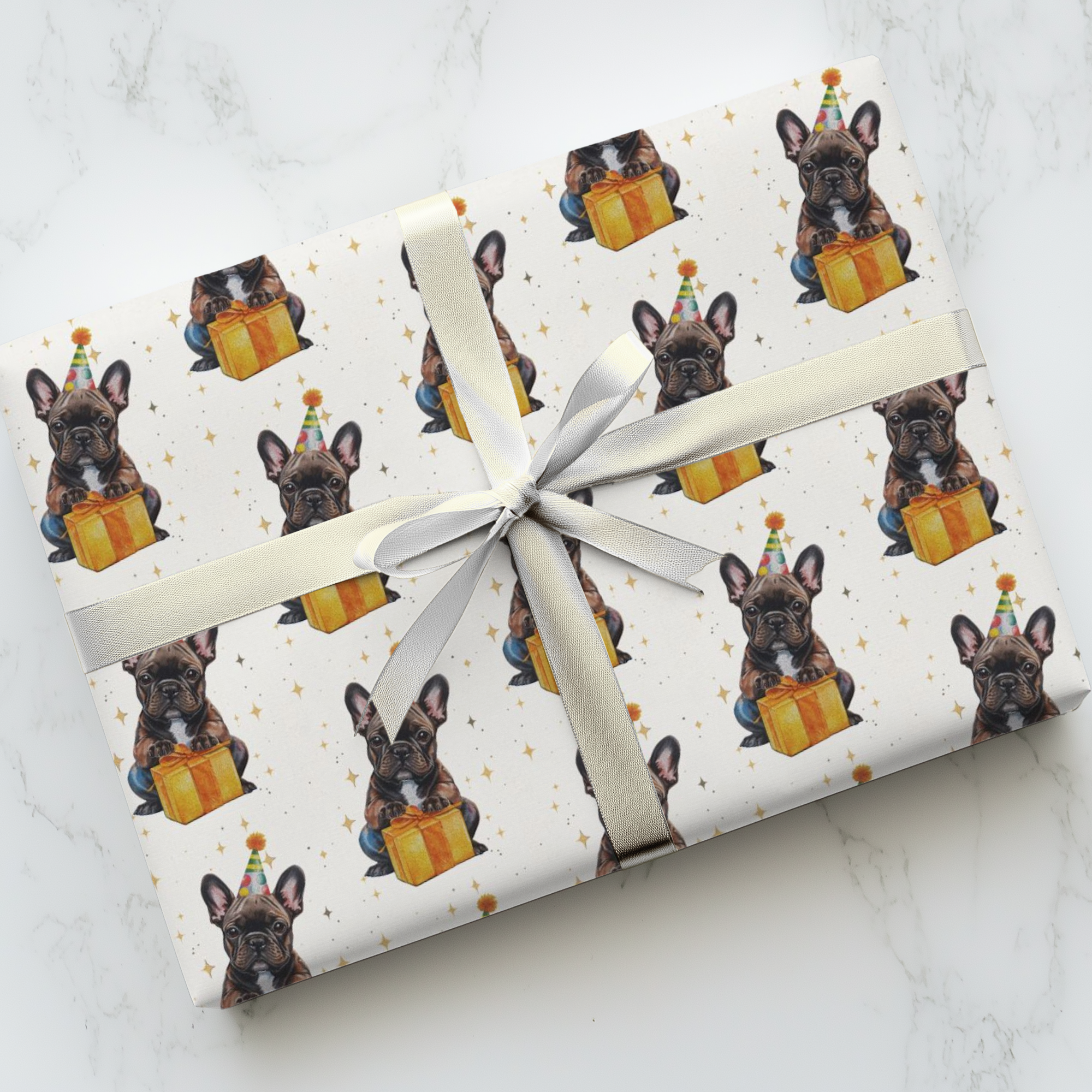 Birthday gift wrapped in paper featuring a french bulldog pattern on a marble surface