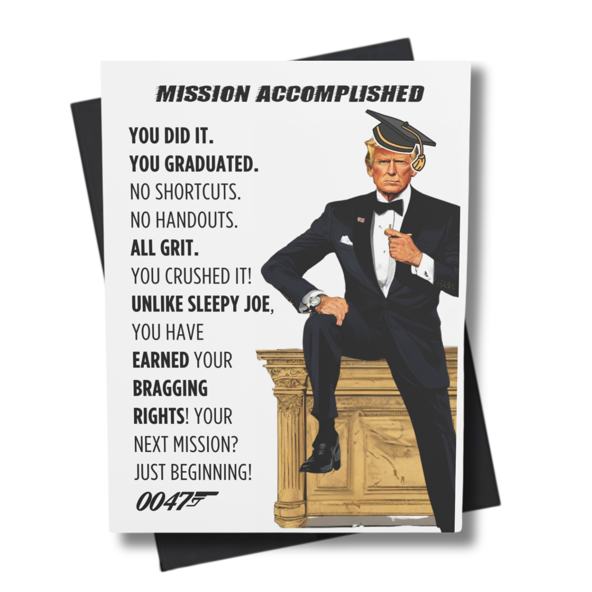 A humorous graduation card featuring a character resembling the President of the United States in a graduation cap and gown, with text 'MISSION ACCOMPLISHED' and other humorous phrases.