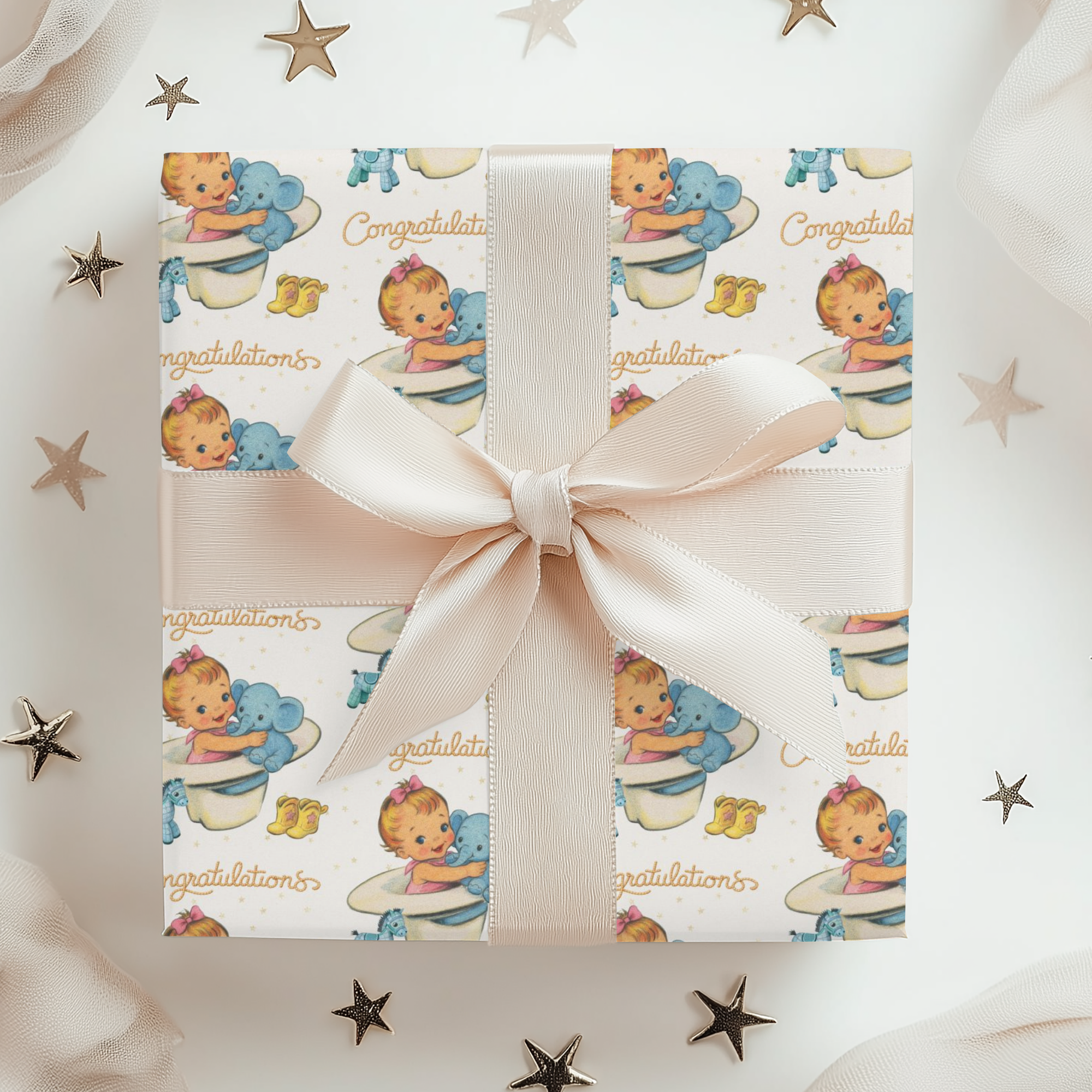 Gift box with cowgirl baby-themed wrapping paper with a pink bow, cowboy hat, surrounded by decorative stars.