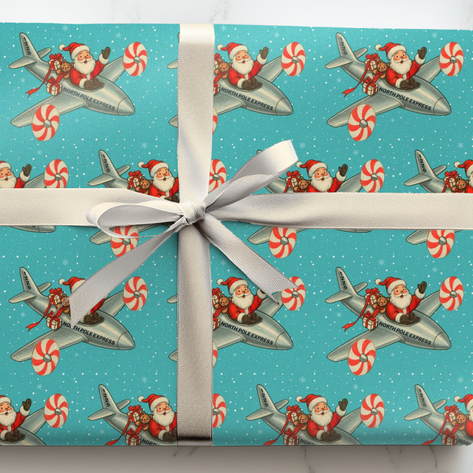 Retro christmas wrappinug paper featuring santa flying peppermint turboprop plane with gifts on a turquoise snowy background.