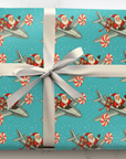 Retro christmas wrappinug paper featuring santa flying peppermint turboprop plane with gifts on a turquoise snowy background.