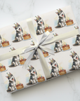Gift wrapped in paper with husky dog and cake design on a white marble surface