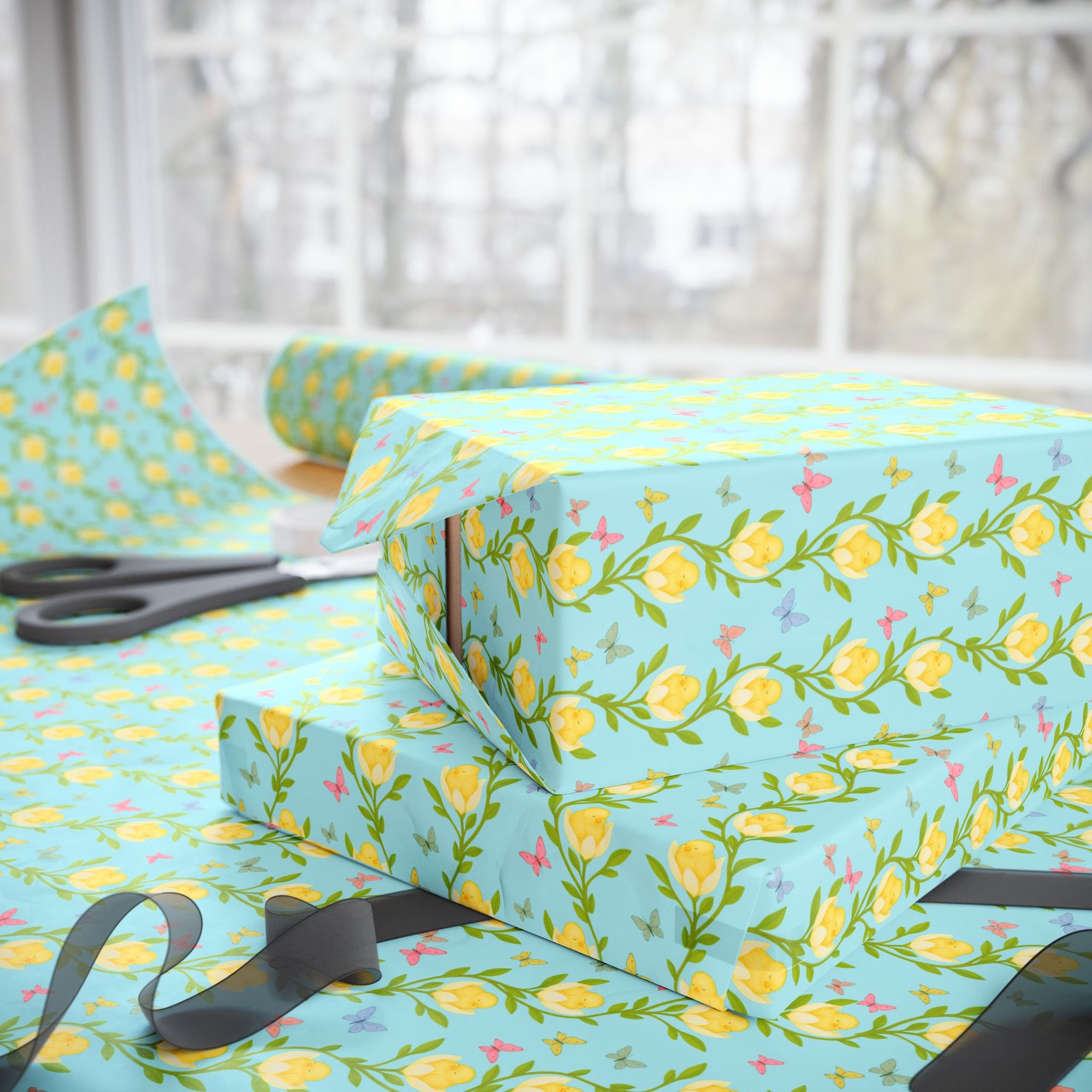 Spring wrapping paper with baby chicks nestled inside yellow flowers and butterflies on aqua background
