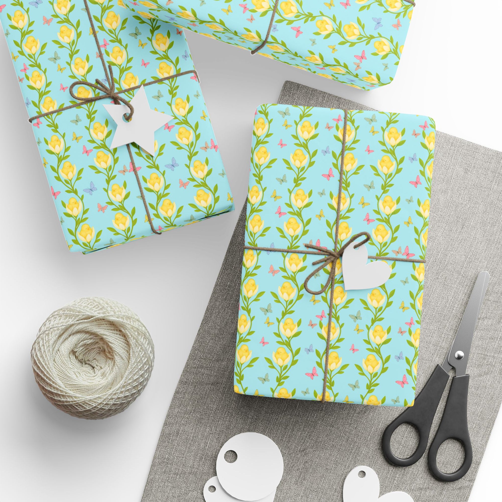 Spring wrapping paper with baby chicks nestled inside yellow flowers and butterflies on aqua background