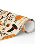 Thanksgiving wrapping paper roll in autumn-themed paper with pumpkins, pilgrims, and leaves.