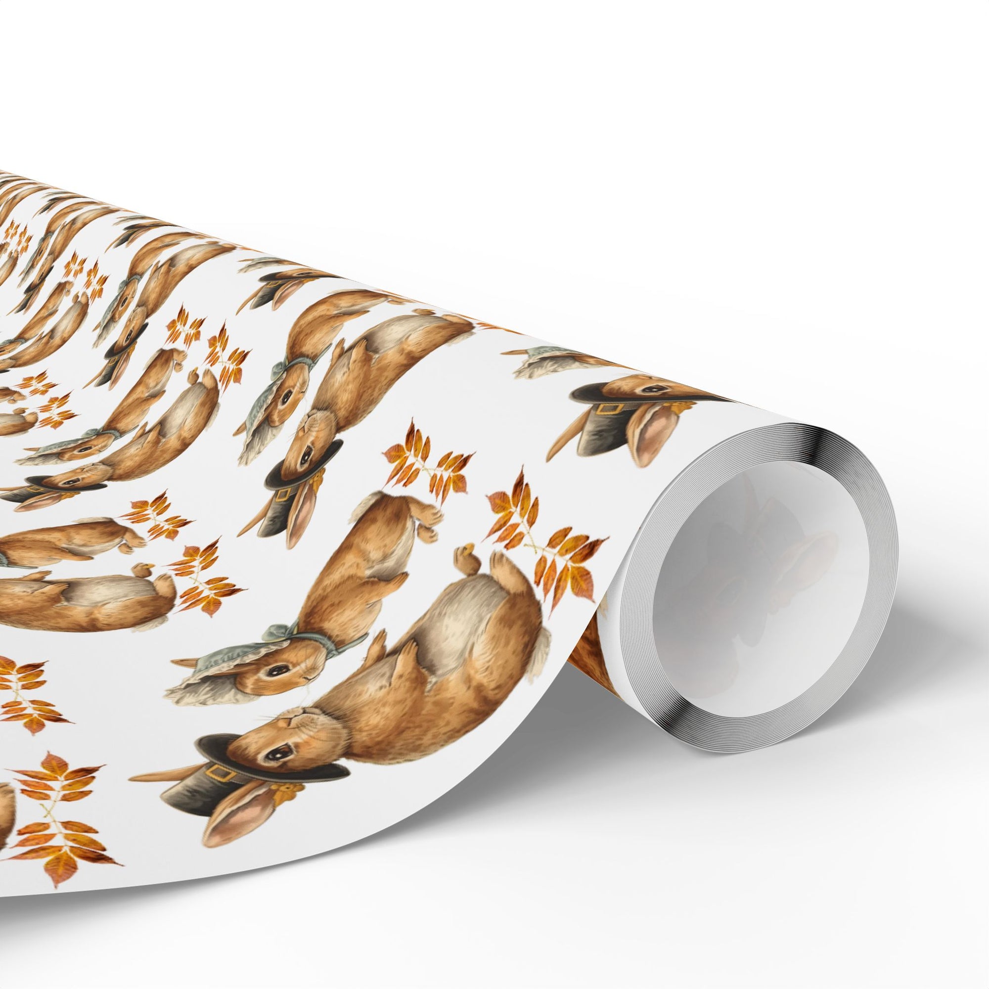 Roll of wrapping paper with bunnies dressed as pilgrims and leaf pattern on a white background.