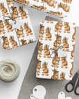 Roll of wrapping paper with bunnies dressed as pilgrims and leaf pattern on a white background.