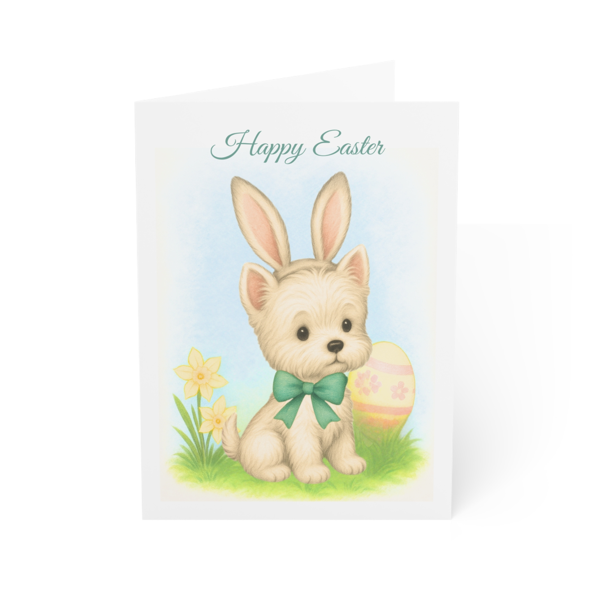 A darling Easter card featuring a Westie with bunny ears resting beside a daffodil and an easter egg.