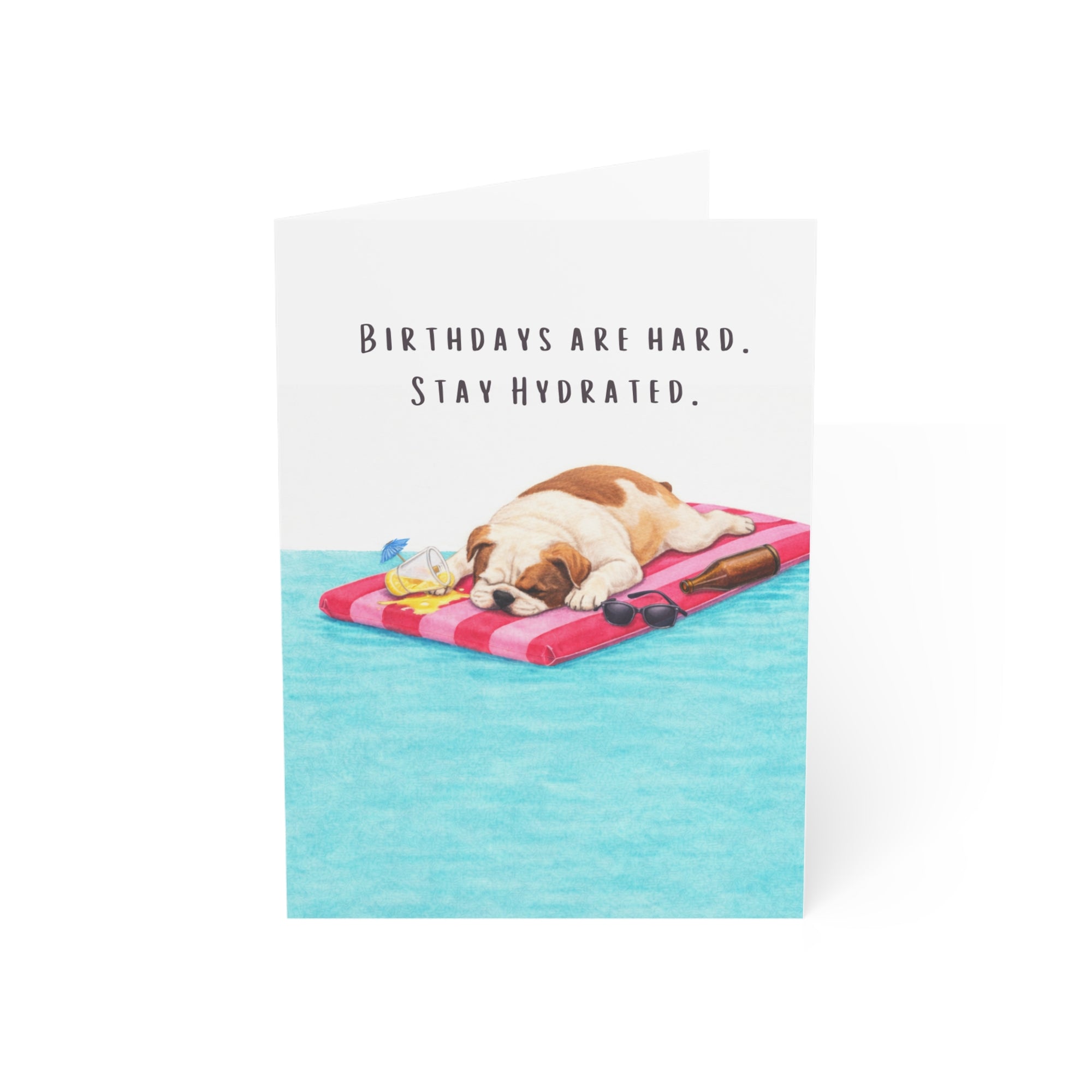 Card with an American bully on a pool float and humorous text about birthdays and hydration.