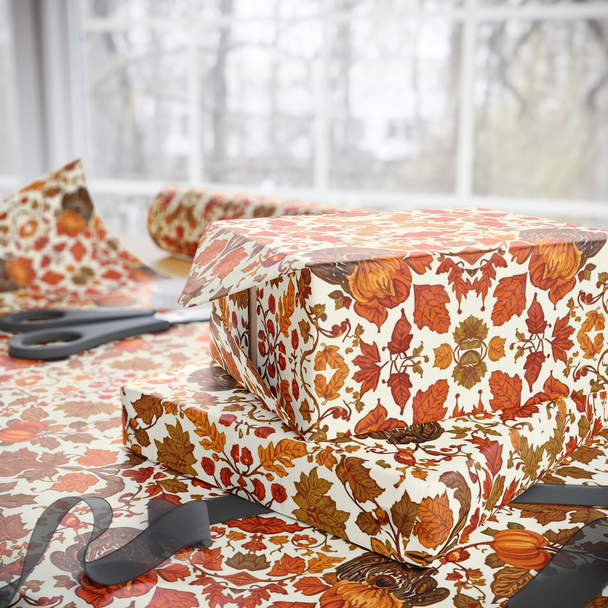 Ornate vintage-style wrapping paper with scrolling autumn leaves and floral pattern in gold, orange, and brown tones.