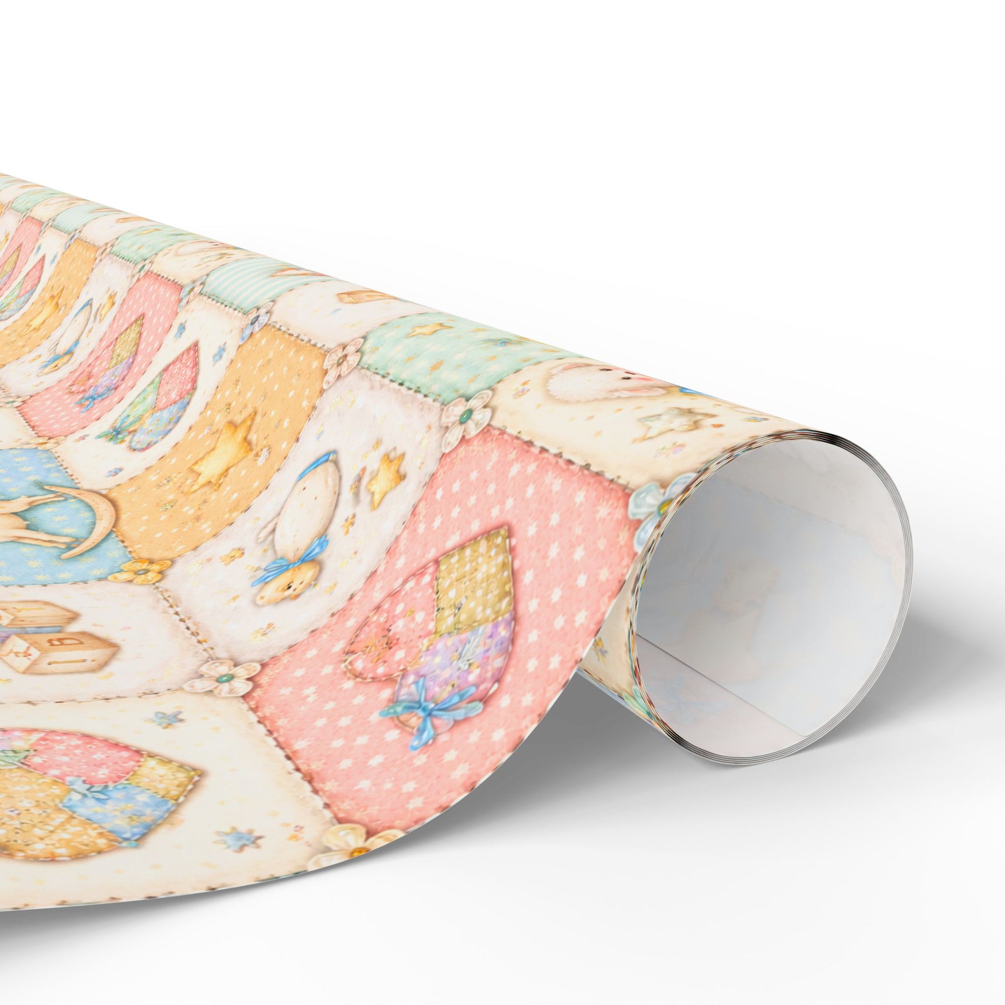 Pastel baby quilt wrapping paper roll with patchwork nursery design in soft pink blue and cream tones.