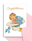 Baby shower card with illustration of a baby holding an elephant toy, surrounded by toys, on a white background.