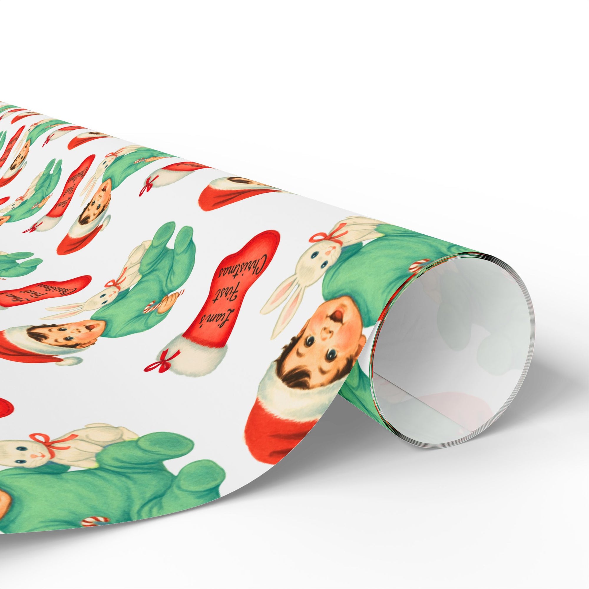 wrapping paper roll of babys first christmas wrapping paper that has a sweet bunny and a little brunette baby boy in a santa cap
