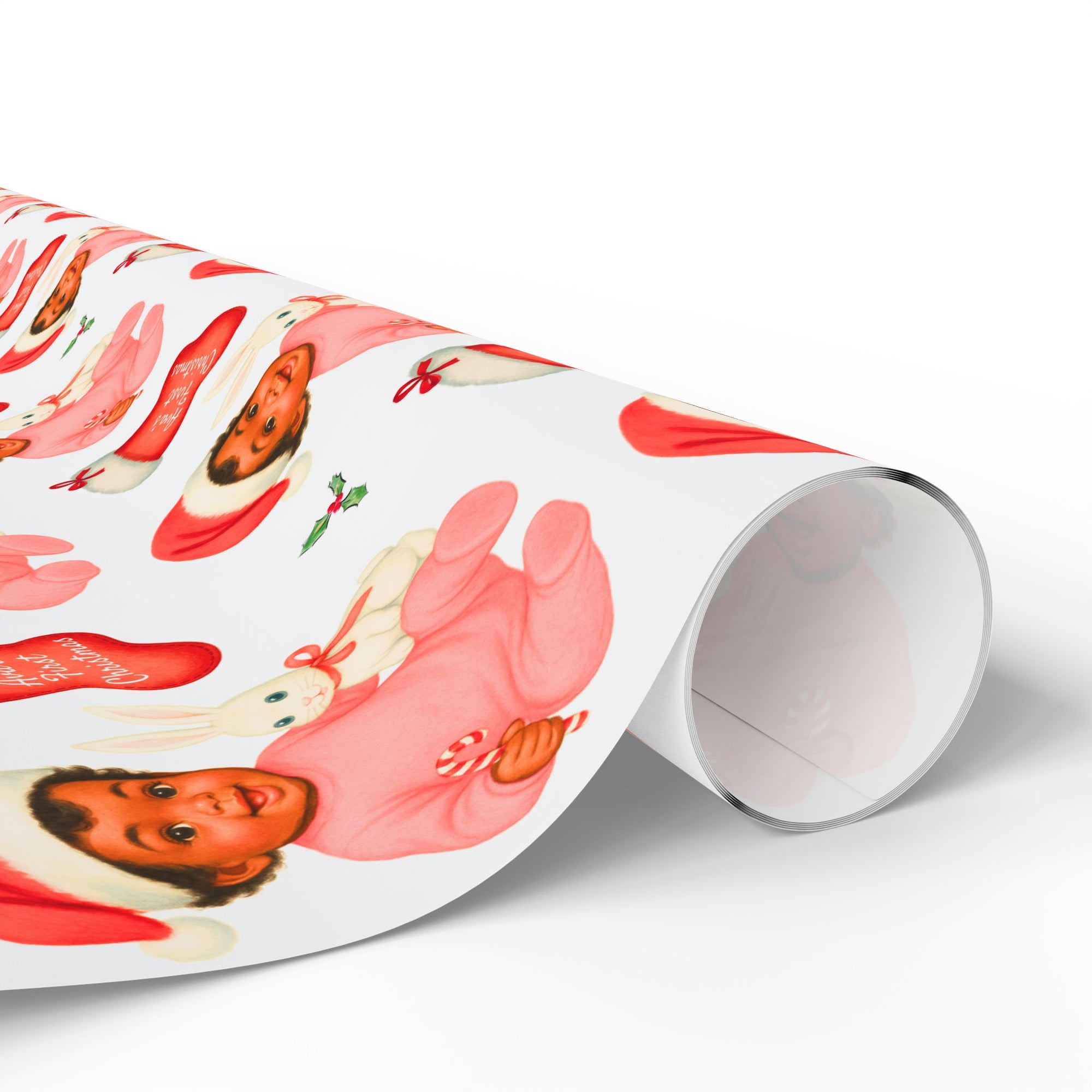 Roll of wrapping paper with an african american baby with a santa hat and a personalized stocking