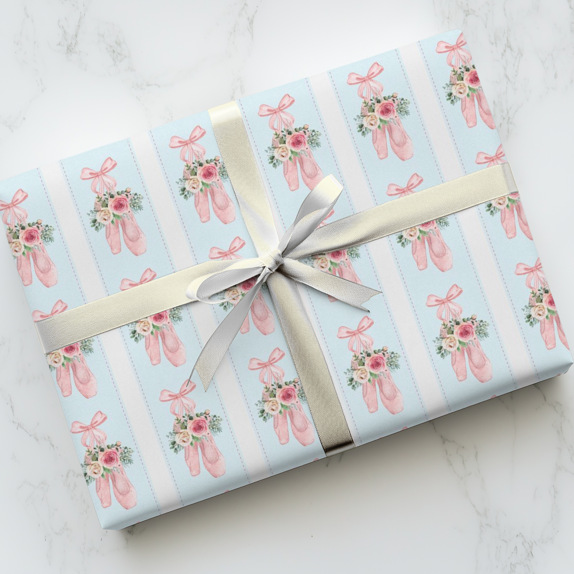 Rose Ballet wrapping paper with pink ballet slippers, frosted roses, and greenery on light blue background