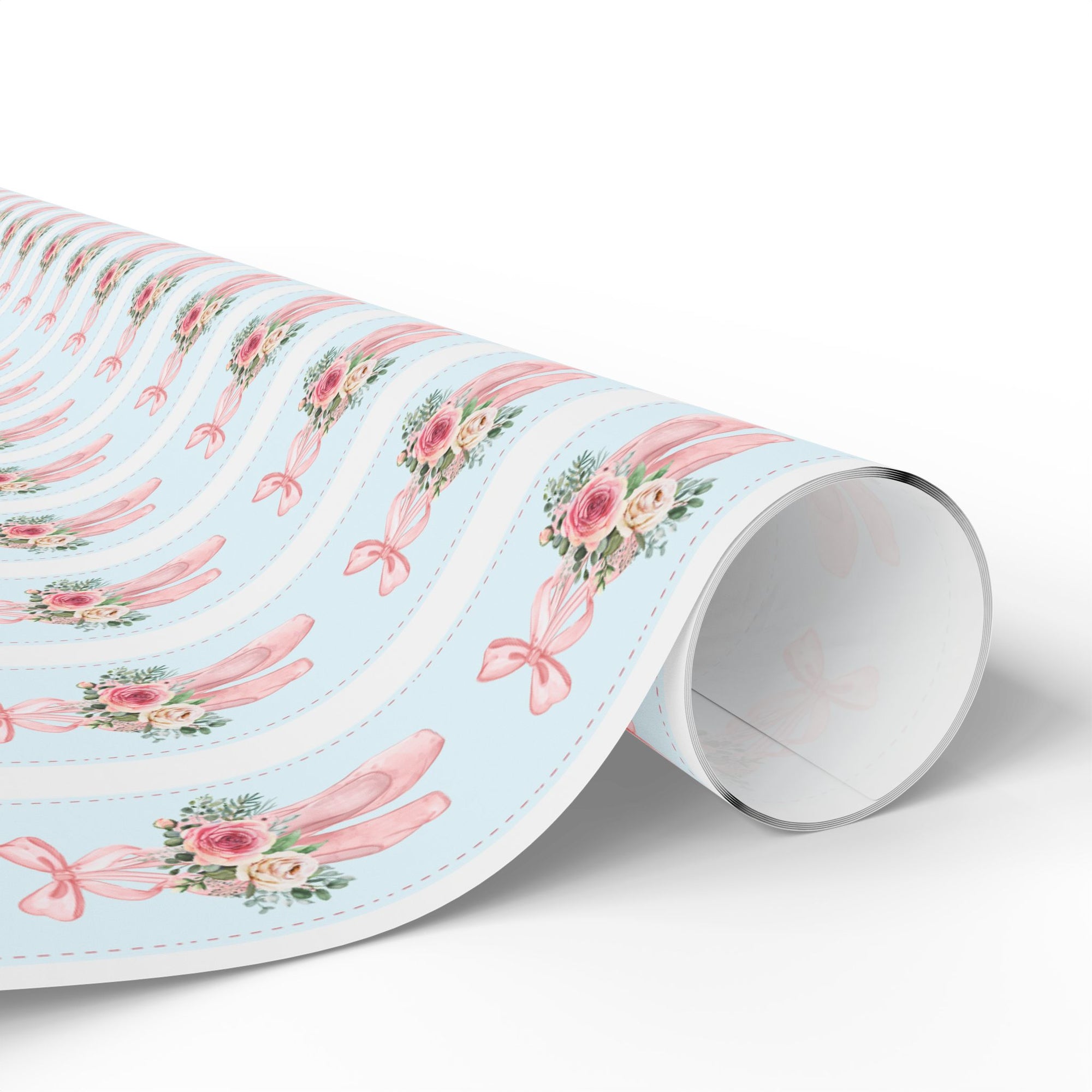 Winter Rose Ballet wrapping paper with pink ballet slippers, frosted roses, and greenery on light blue background