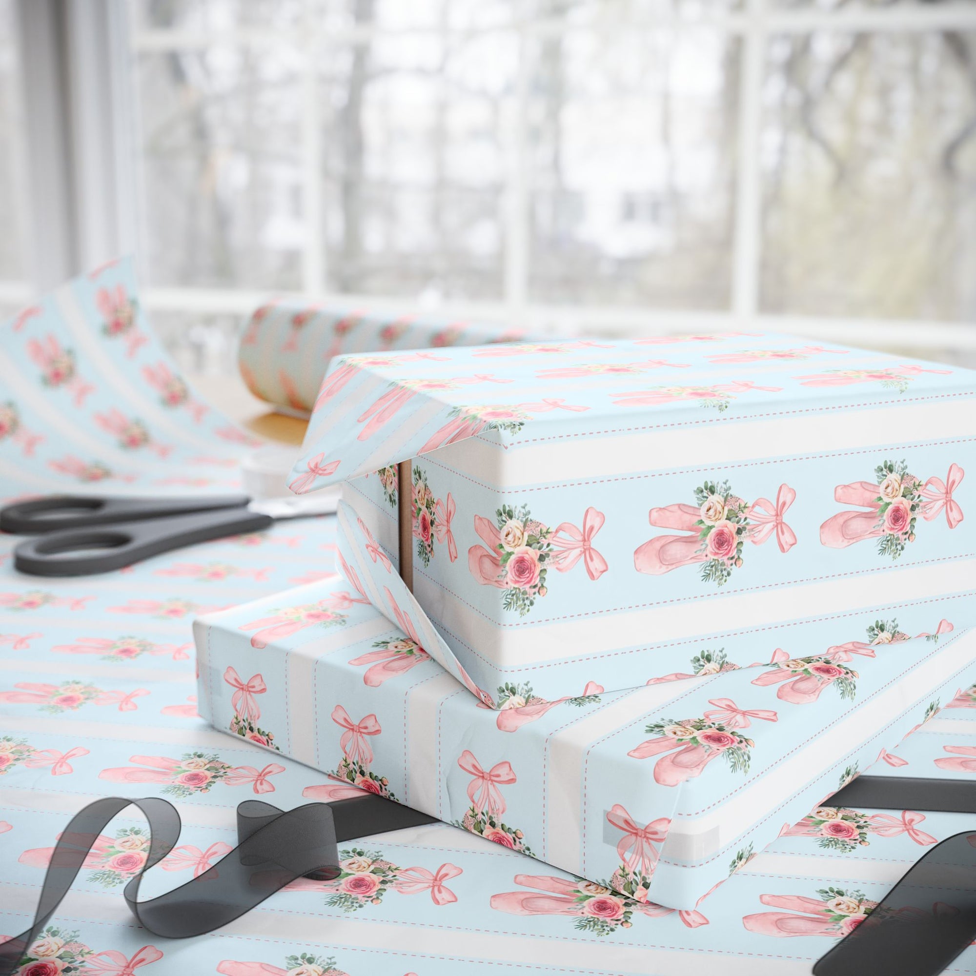 Winter Rose Ballet wrapping paper with pink ballet slippers, frosted roses, and greenery on light blue background