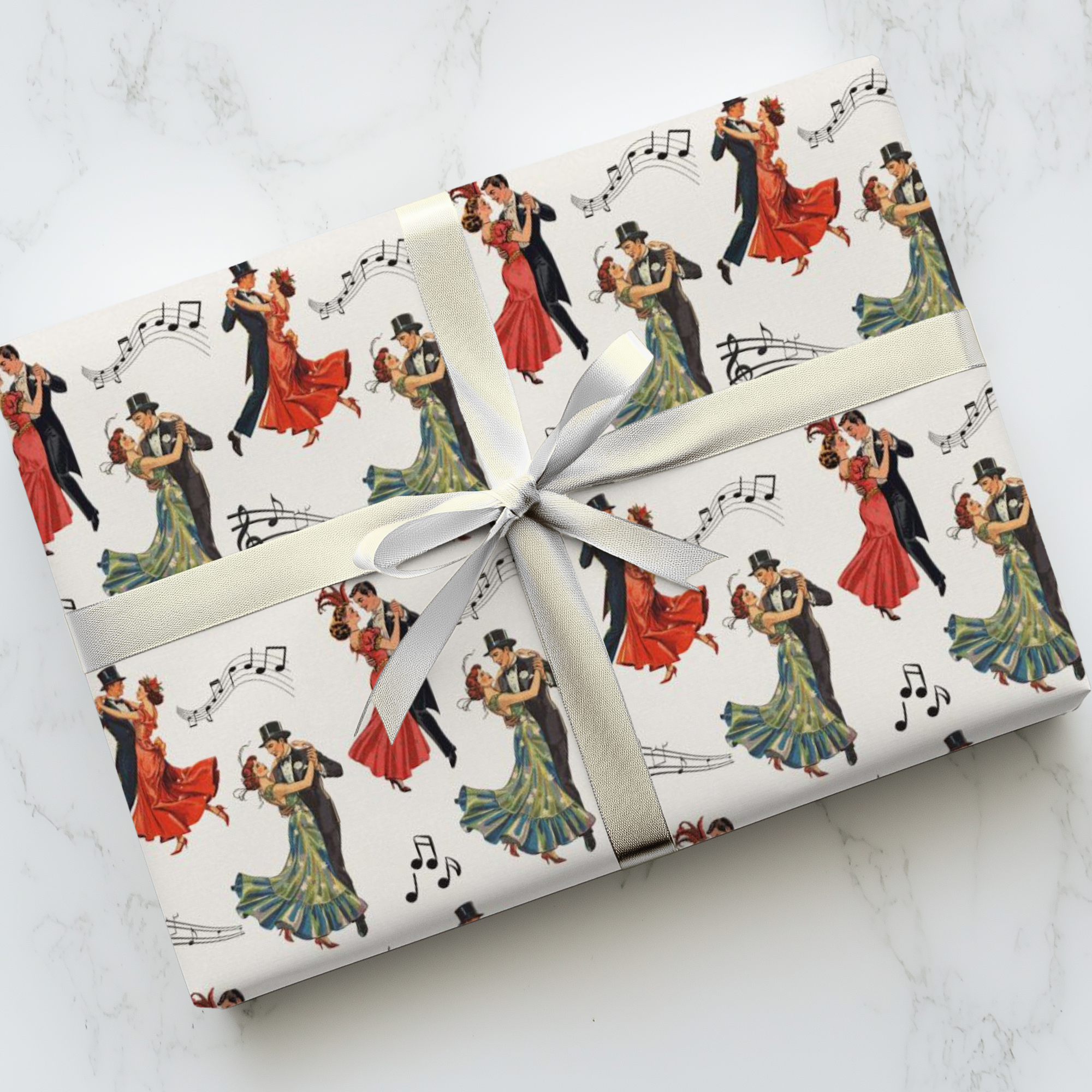 Gift wrapped in vintage-style dance-themed paper featuring couples in formal attire ballroom dancing with a white ribbon on a light background.
