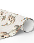 Roll of wrapping paper with puppy illustrations on a pastel background