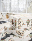 Present wrapped in puppy-themed wrapping paper in soft pastels