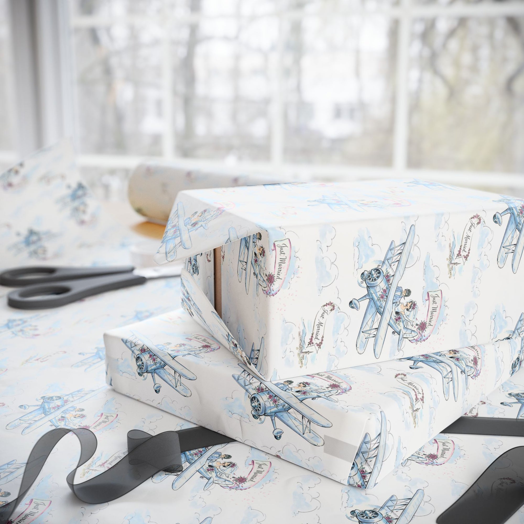 Bride and groom flying in a vintage biplane with bouquet petals falling through the sky.