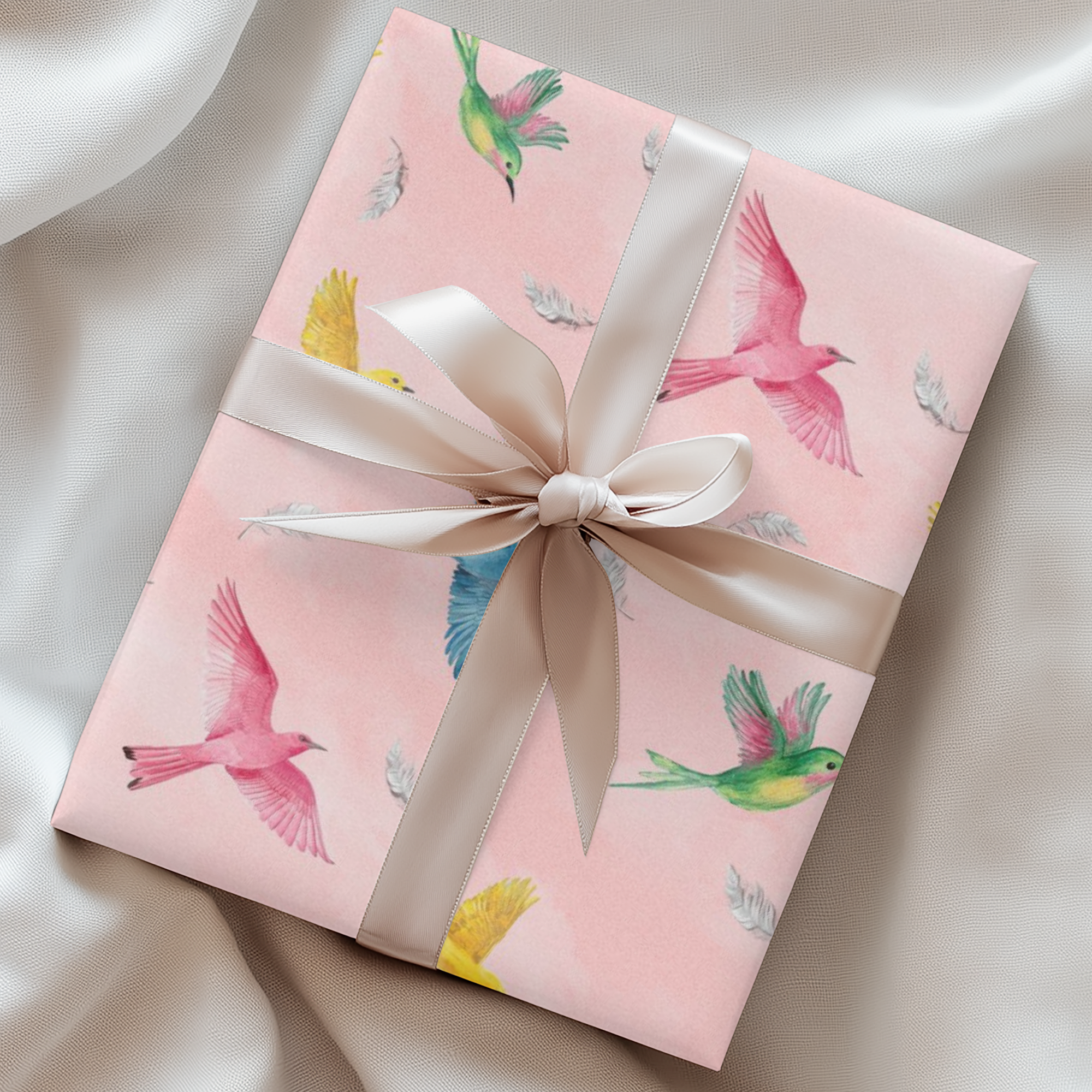 Pink wrapping paper with colorful birds flying and soft feathers scattered throughout.