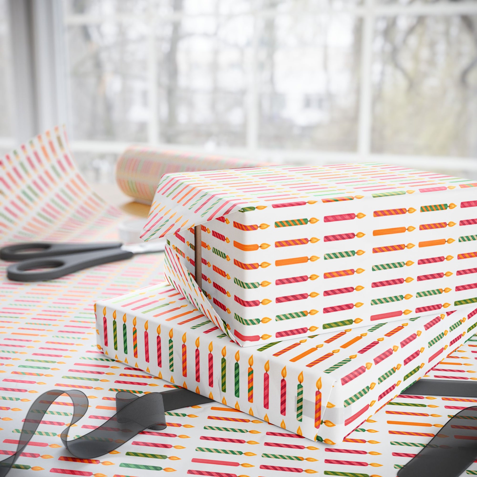 roll of wrapping paper featuring birthday candles in every color.
