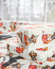 Birthday gift wrapped in paper with boxer dog illustrations on a white background.