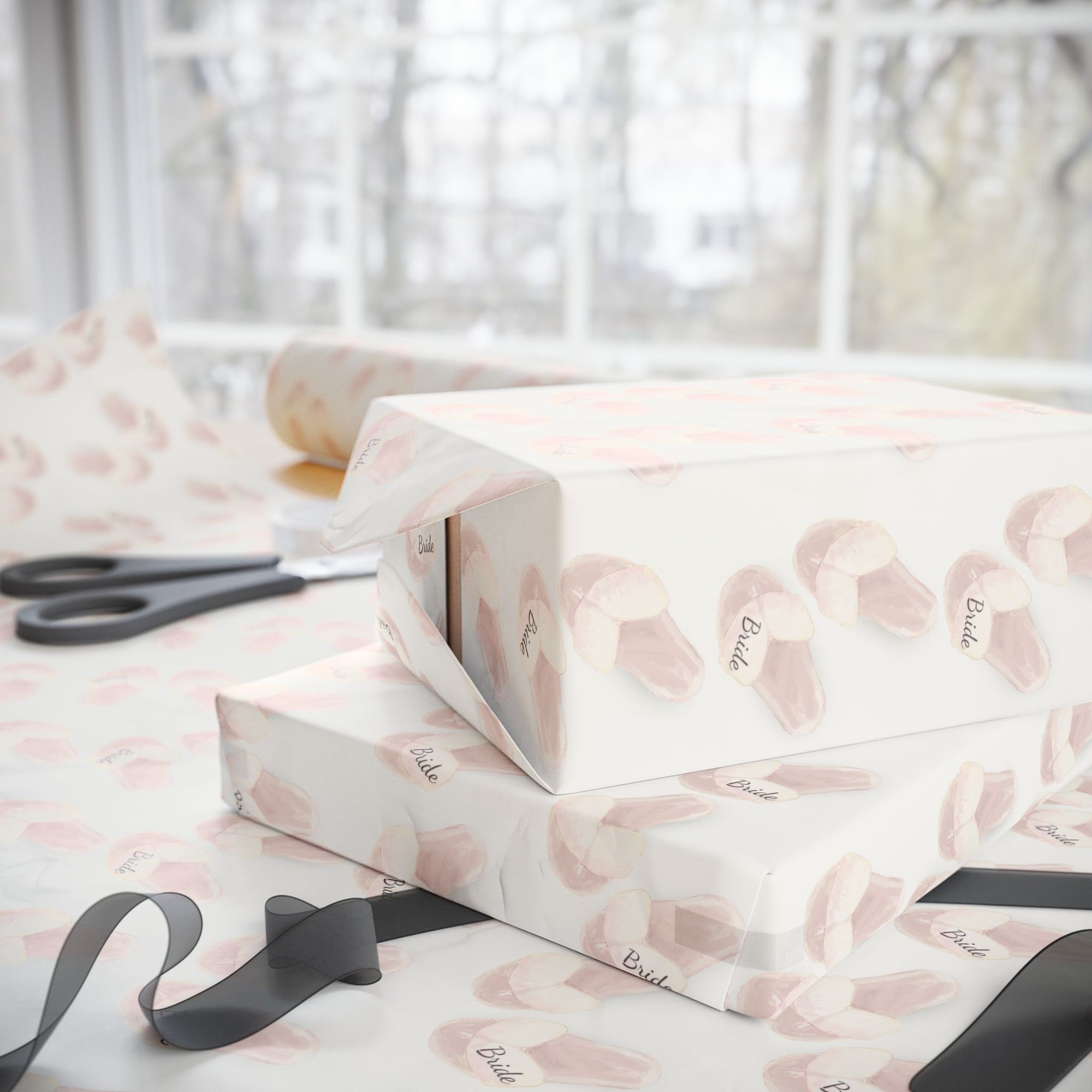 Bridal shower gift wrapped in bride slippers wrapping paper with ribbon.
