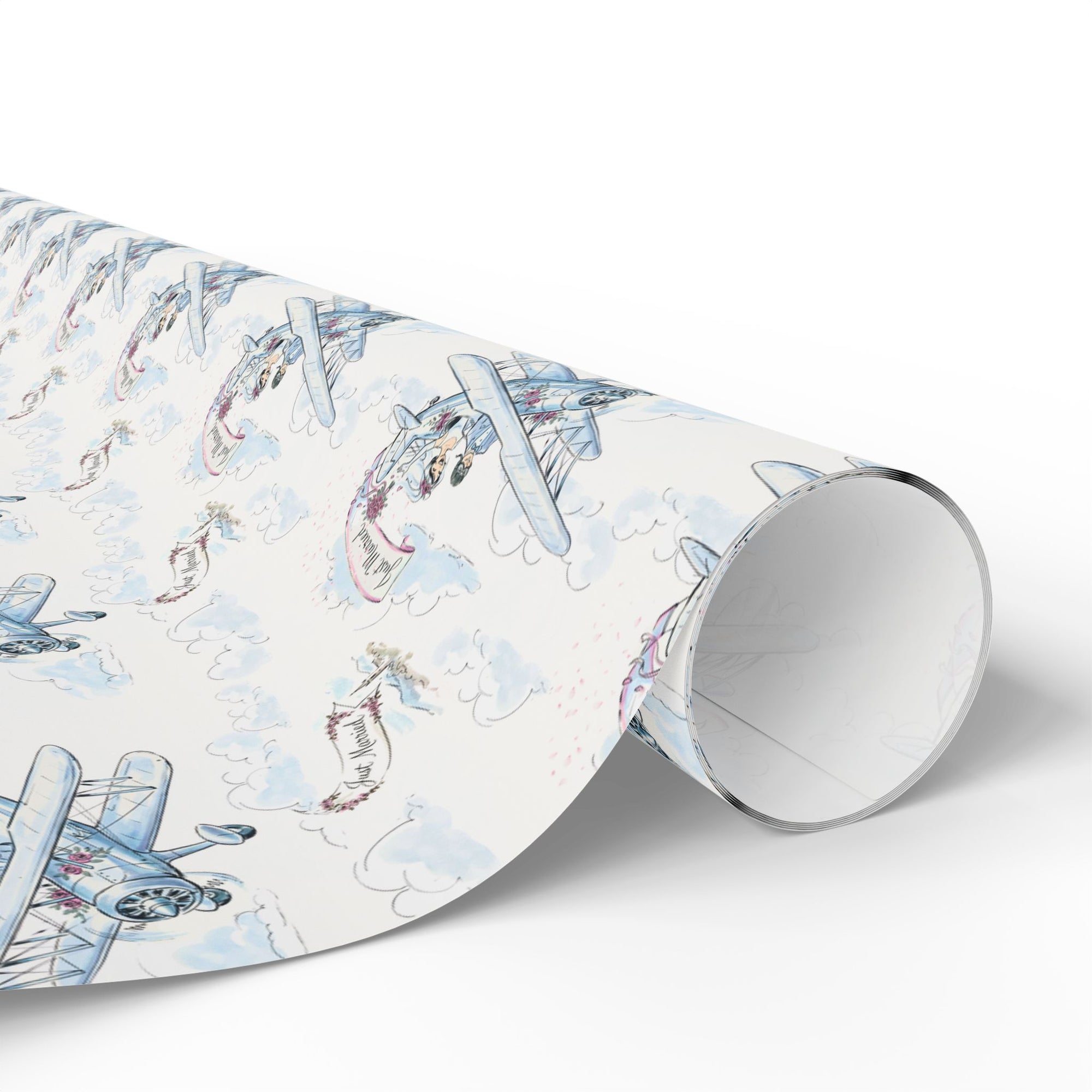 Roll of wedding wrapping paper with a biplane design on a light background.