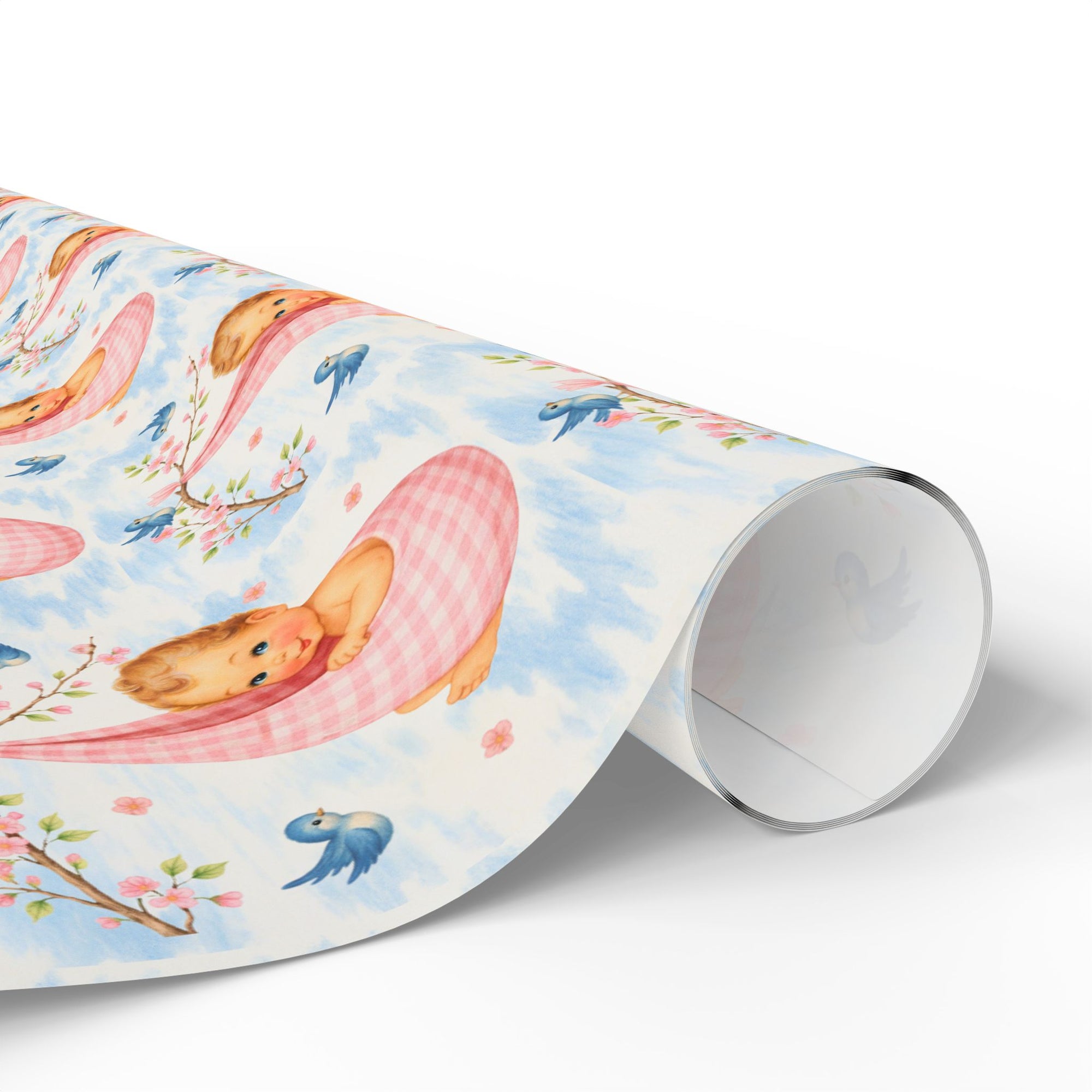 Roll of wrapping paper with baby and cherry blossom design on a light background
