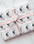 Retro wedding and bridal wrapping paper with a retro bride and groom cutting a wedding cake.
