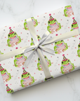 Frog wrapping paper pattern showing watercolor frogs with party hats on a light background.