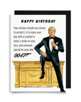 Funny spy themed birthday card featuring Trump as agent 0047 in a tux holding a martini glass, sitting on a desk with text with a humorous message.