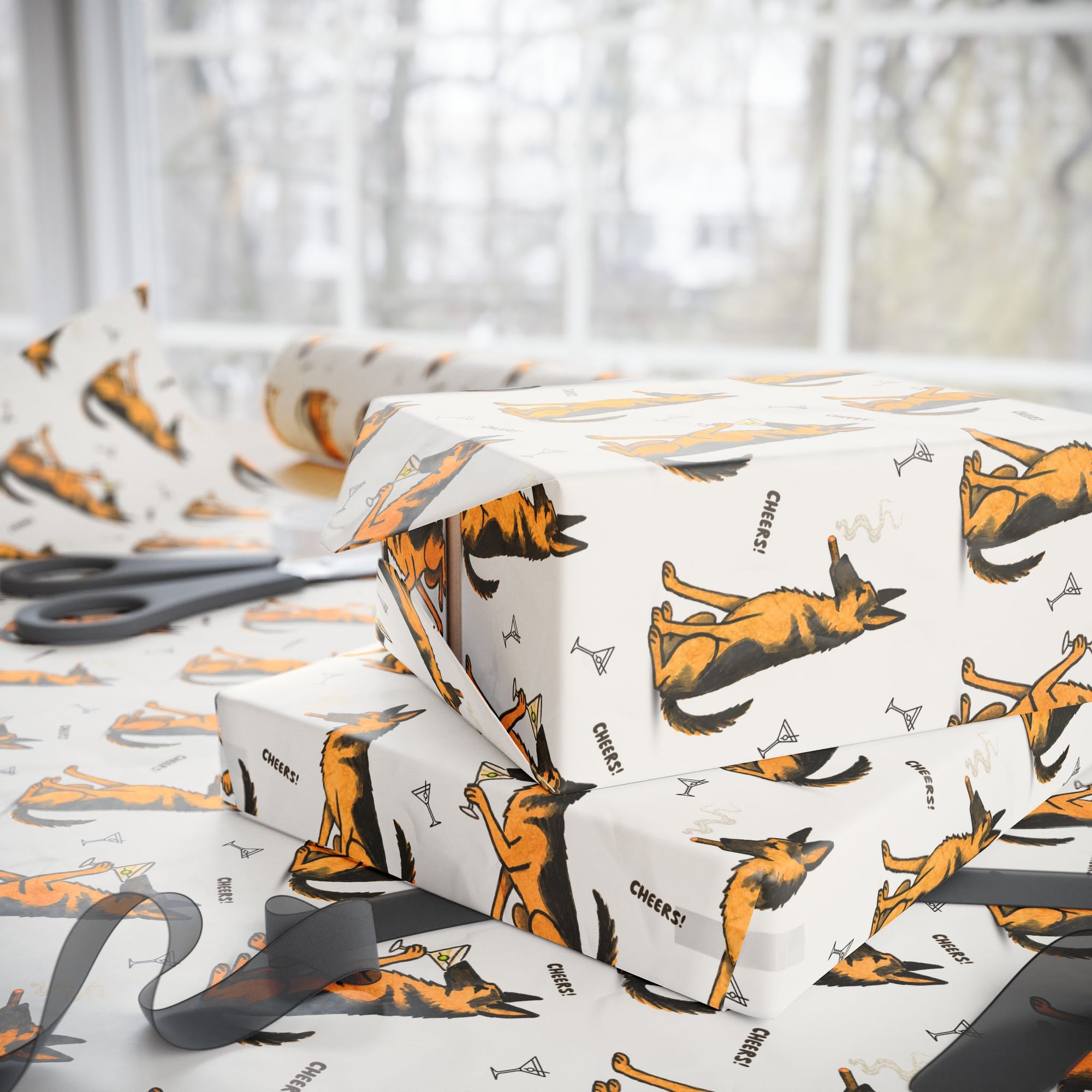 Gift box wrapped in paper with dog pattern and ribbon, scissors on white surface.